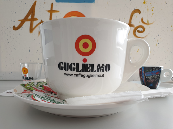 White ceramic coffee mug with saucer